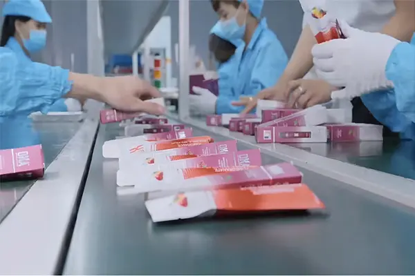 Cleanroom vape production line with trained technicians assembling disposable e-cigarettes