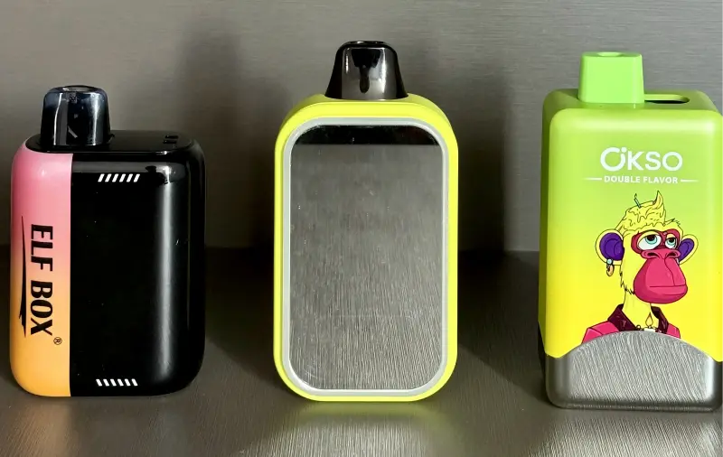 Three of the best disposable vapes 2025: ELFBOX PulseX 25K smart compact vape, OKSO Magic Mirror 50K stylish mirror design, and OKSO Double Flavor 60K dual-flavor disposable vape